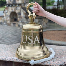  14 inch diameter 52 pound polished finish bell with shackle shown with hand for size comparison