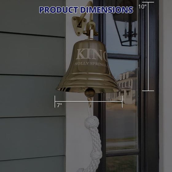 7 inch highly polished solid brass wall bell with graphics showing dimensions of 7 inches across base of bell and ten inches high including mount, but not pull rope