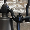 Closeup of medium railroad bell cast iron carriage arm attachment