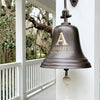 10 inch diameter dark bronze wall bell closeup on southern style porch