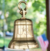 14 inch diameter polished brass bell with shackle with flag in background