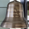 Closeup of engraved 6 inch antiqued brass wall bell