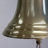 Closeup of antiqued brass patina on a bell