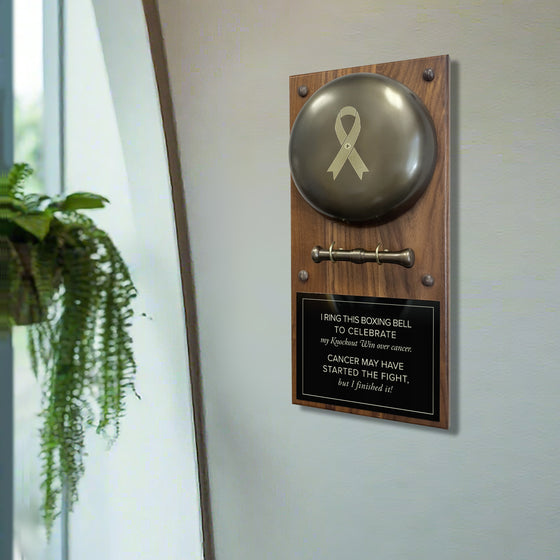 Cancer Ribbon Engraved Boxing Bell on Plaque by a Window