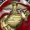 Close-up of a gold emblem with an eagle and globe on a red background
