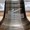Closeup of 12 inch diameter antiqued brass ridged bell shown with engraved Harley-Davidson logo of Cleveland, Ohio company