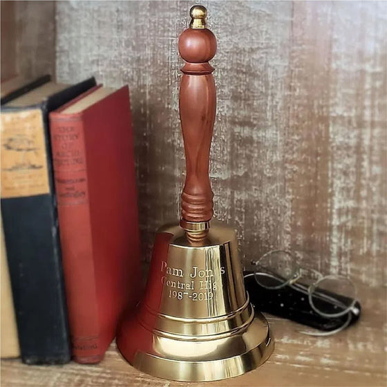 11 inch tall polished finish brass hand bell with contoured hardwood handle and three lines of custom engraving