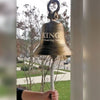 12 inch ridged hanging bell with two lines of optional text engraving and a hand pulling on a long cotton braided pull rope