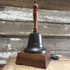 13 inch tall dark bronze finish brass and wood hand bell shown on a deluxe walnut wood square base