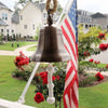8 inch diameter antique finish ridged hanging bell with shackle hanging from rope with American Flag in background