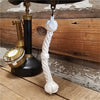 Closeup of hand braided white cotton bell pull rope with 3 knot design