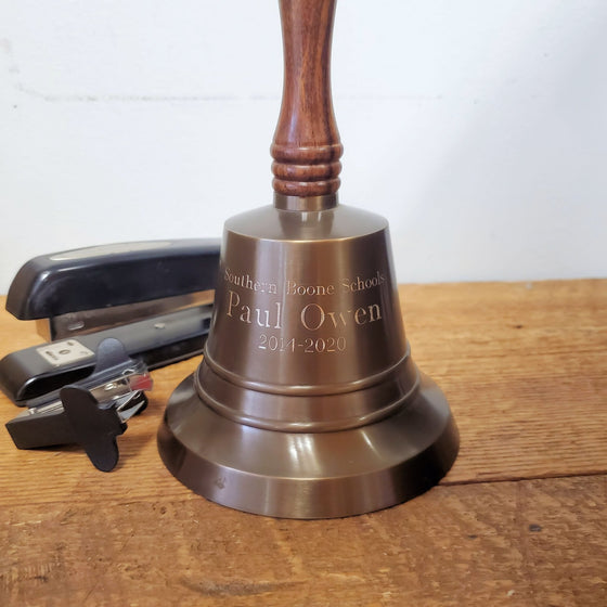 9 inch antiqued brass wall bell shown with three lines of optional engraving