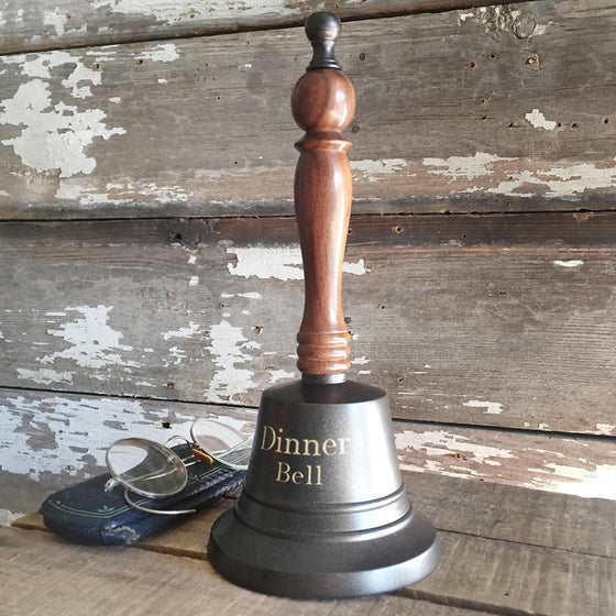 Dark bronze finish 9 inch tall brass and wood hand bell shown with two lines optional engraving