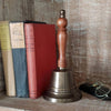 11 inch tall antiqued brass hand bell with contoured hard wood handle