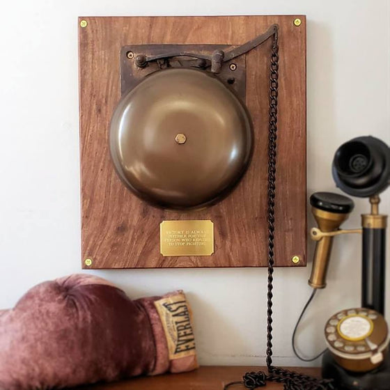 Large replica vintage brass boxing bell with antique finish on a wood plaque with engraved brass plate