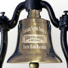 Closeup of optional logo engraving on front of a medium polished brass railroad bell