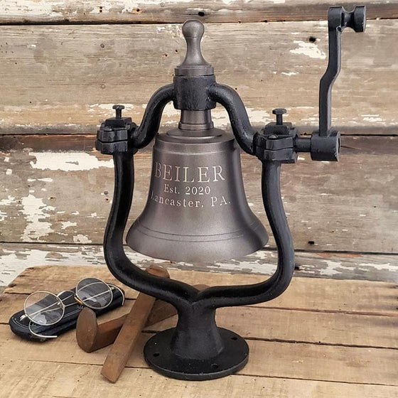 Medium dark bronze finish brass railroad bell with three lines of personalized engraved text