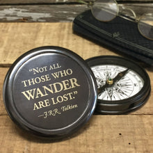  Three inch diameter antiqued brass compass with Tolkien quote "Not all those who wander are lost" engraved on front